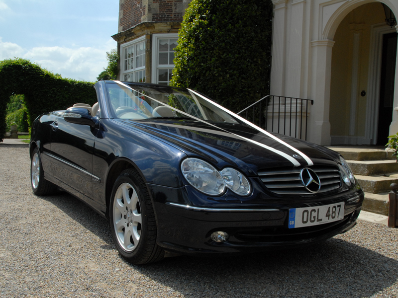 Mercedes 3.2 CLK 320 in Tansinite Blue with Ivory leather interior.